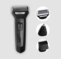 Kemei electric shaver with attachments on a light gray background